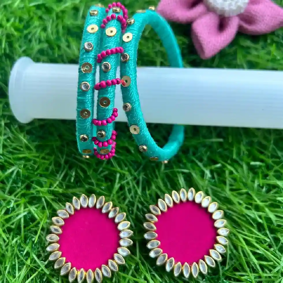 Handcrafted teal silk thread bangles with gold sequins and Rani pink bead accents, paired with matching pink silk thread circular stud earrings featuring Kundan stone borders.